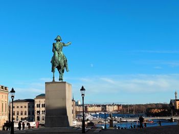 Low angle view of statue against sky