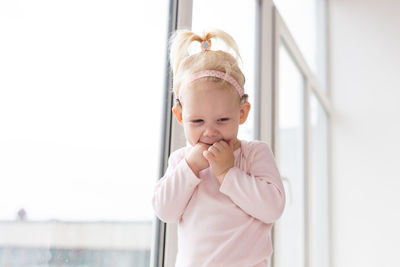 Portrait of cute girl with daughter at home