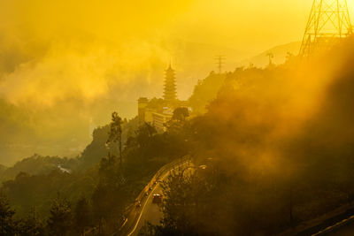 Panoramic view of buildings in city during sunset