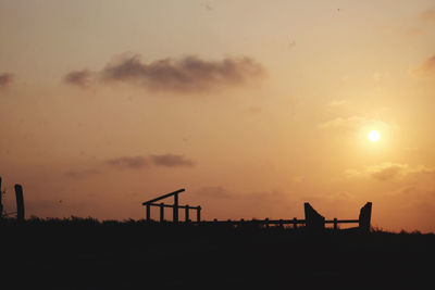 Scenic view of silhouette land against sky during sunset