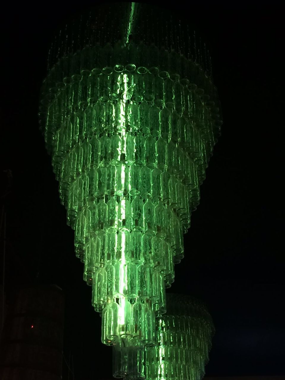 LOW ANGLE VIEW OF ILLUMINATED LAMP AGAINST BLACK BACKGROUND