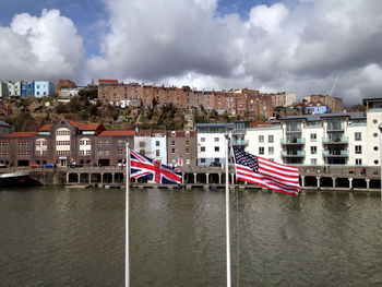 American and british flag against the town