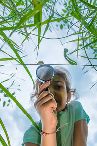 Low angle view of woman wearing sunglasses