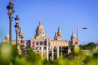 View of museum against clear blue sky