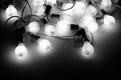 High angle view of illuminated light bulbs on table