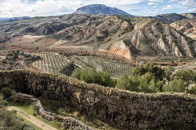 View of landscape against mountain range