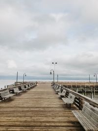 Pier over sea against sky