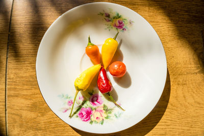 High angle view of fruits in plate on table