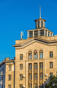 Low angle view of building against blue sky