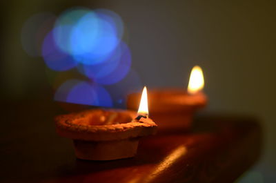 Close-up of diyas on table