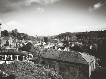 View of town against cloudy sky