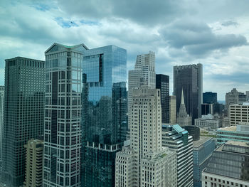Modern buildings in city against sky