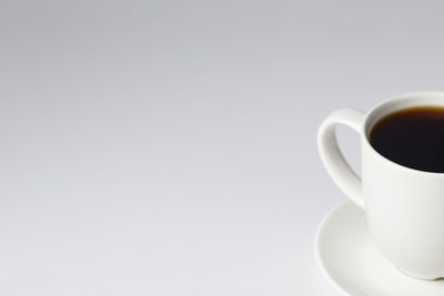 Close-up of coffee cup against white background