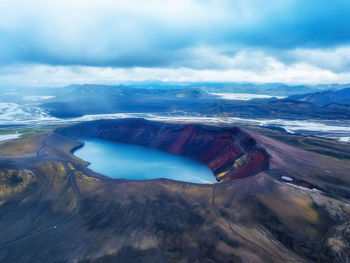 Aerial view of volcanic landscape against sky