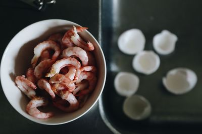 High angle view of fresh shrimp in bowl on table