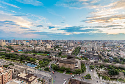 High angle view of buildings in city against sky