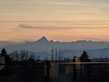 Scenic view of mountains against sky during sunset