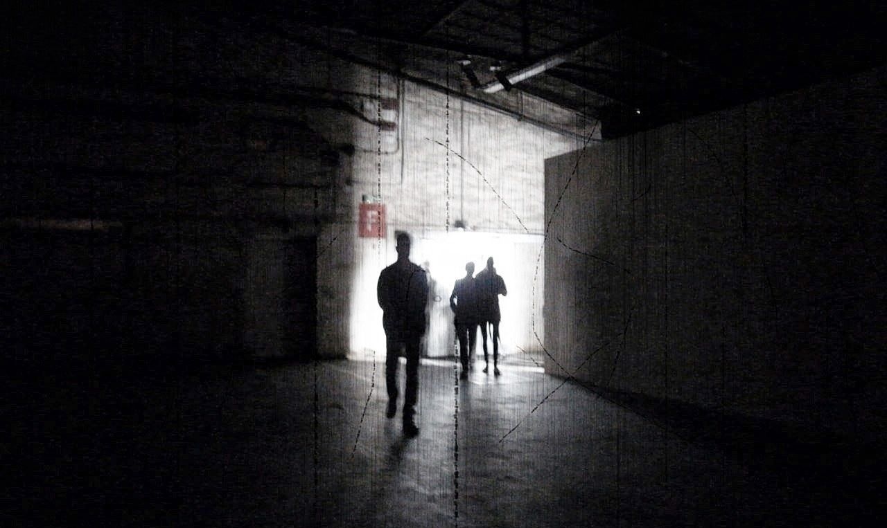 indoors, walking, full length, silhouette, rear view, men, architecture, lifestyles, built structure, corridor, the way forward, person, tunnel, wall - building feature, illuminated, dark, leisure activity
