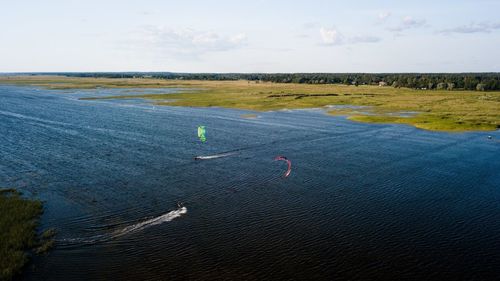 High angle view of land and sea against sky