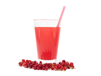 Close-up of red berries against white background