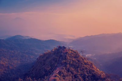 High angle view of mountain against cloudy sky