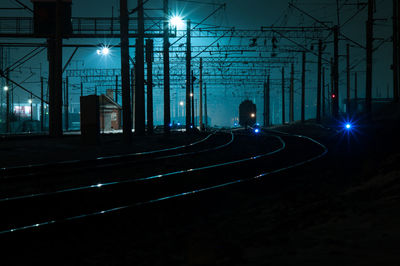 Light trails on illuminated street at night