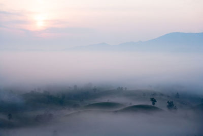 Scenic view of mountains against sky during sunset