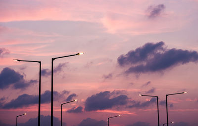 Low angle view of street light against sky during sunset