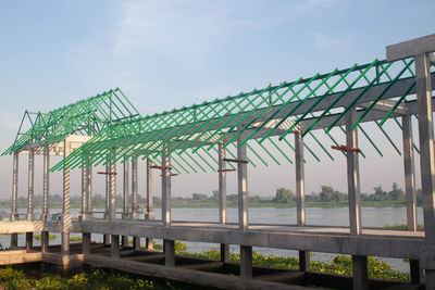 Built structure on beach against sky