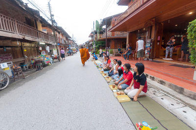 People on narrow street in town