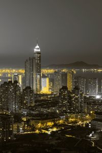 Illuminated buildings in city at night