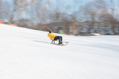 Man riding bicycle on snow