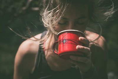 Close-up of woman drinking water