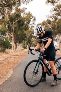 Man riding bicycle on field