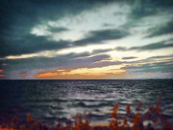 Scenic view of sea against dramatic sky