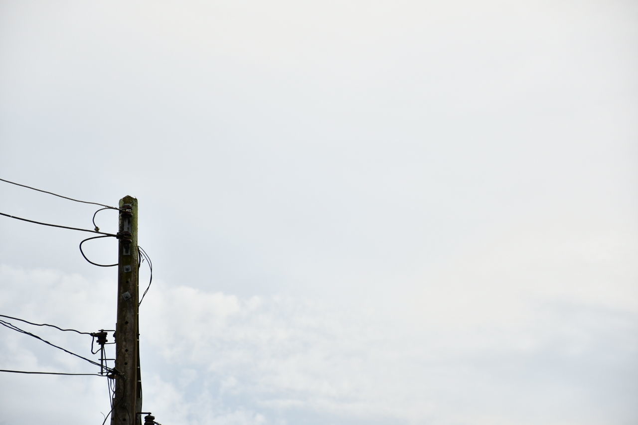 LOW ANGLE VIEW OF POWER LINES AGAINST SKY