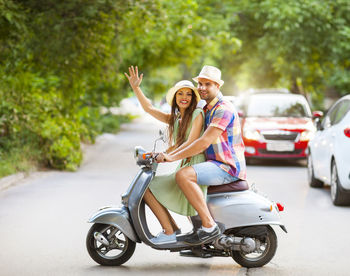 Portrait of a smiling young woman on road