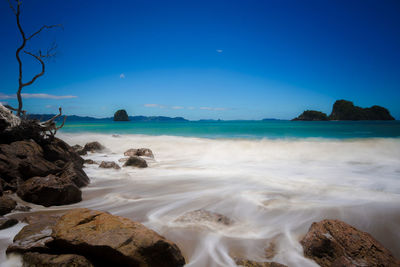 Scenic view of sea against clear blue sky