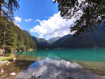 Scenic view of lake and mountains against sky