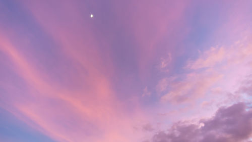 Low angle view of dramatic sky at sunset