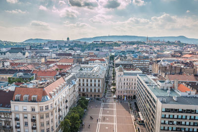 High angle view of buildings in city against sky