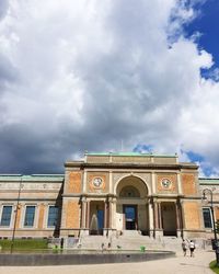 Low angle view of historical building against cloudy sky