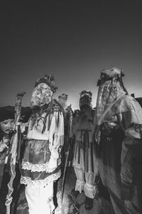 Ancient carnival of sauris. traditional wooden masks. black and white. italy