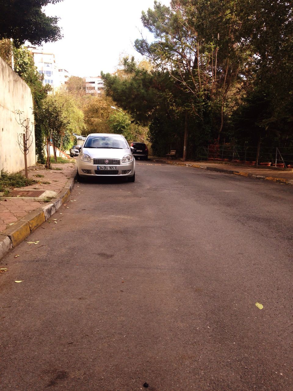 CARS ON STREET AGAINST CAR ON ROAD