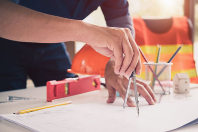 Close-up of man working on table