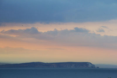 Scenic view of sea at sunset