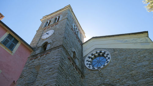 Low angle view of clock tower against sky