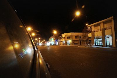 Illuminated street light at night