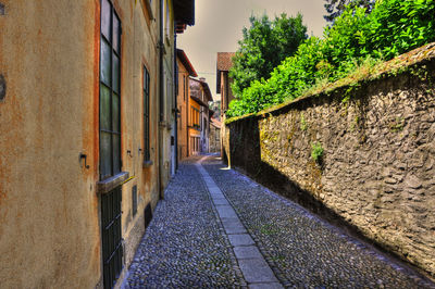 Alley amidst buildings in city