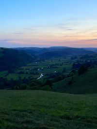 Scenic view of landscape against sky during sunset